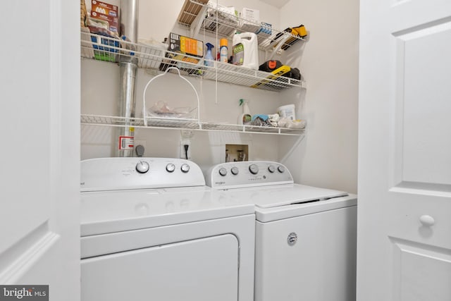 washroom featuring washer and dryer and laundry area