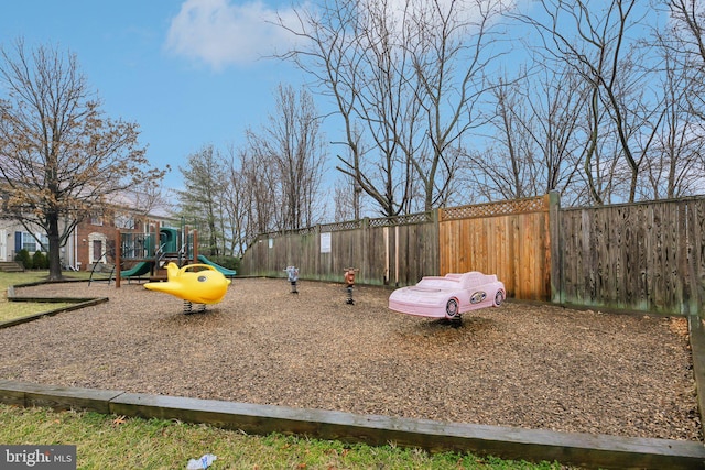 view of jungle gym featuring fence