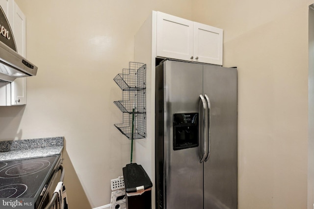 kitchen featuring stainless steel appliances, under cabinet range hood, light stone countertops, and white cabinets