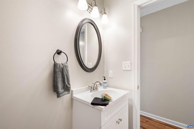 bathroom with baseboards and vanity