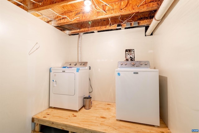 clothes washing area with laundry area and independent washer and dryer