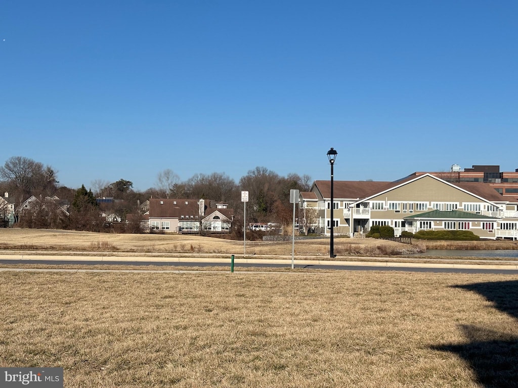 view of property's community featuring a lawn