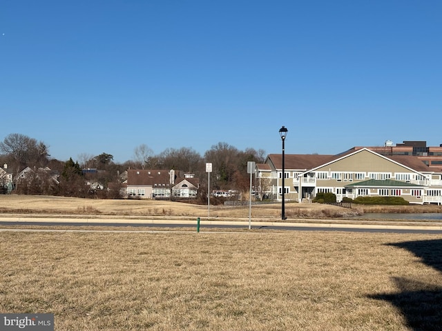 view of property's community featuring a lawn