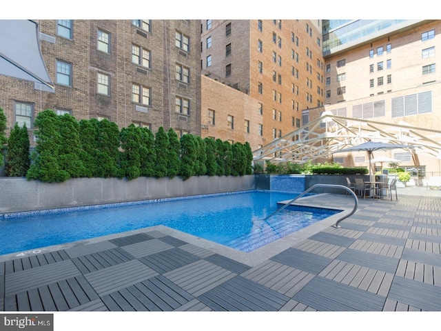 community pool featuring a patio area