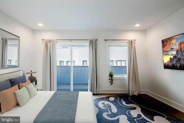 bedroom featuring recessed lighting, wood finished floors, and baseboards