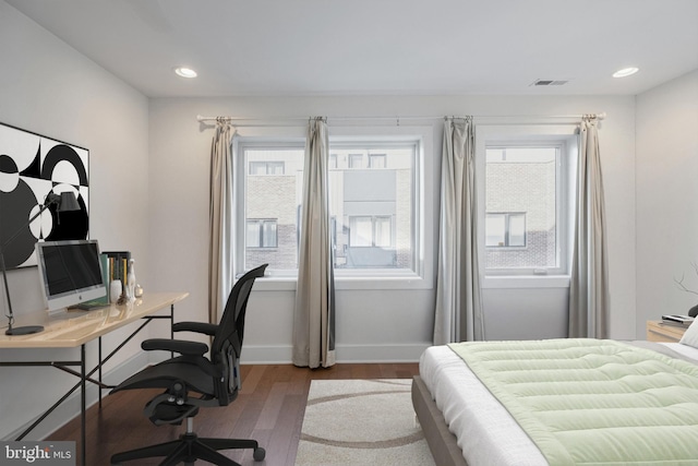 bedroom featuring recessed lighting, wood finished floors, visible vents, and baseboards