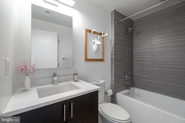 full bathroom featuring visible vents, shower / bathing tub combination, vanity, and toilet