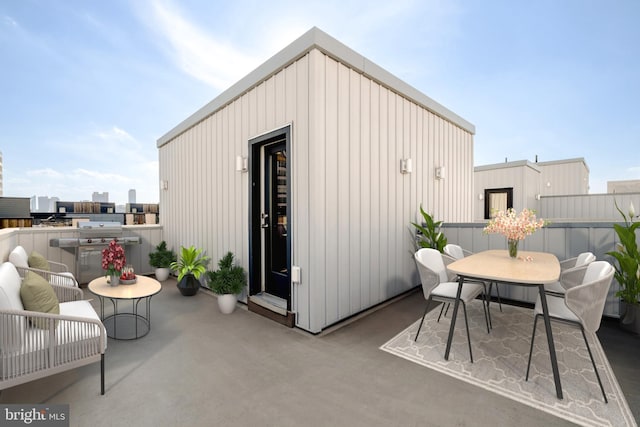 view of outdoor structure with outdoor dining area