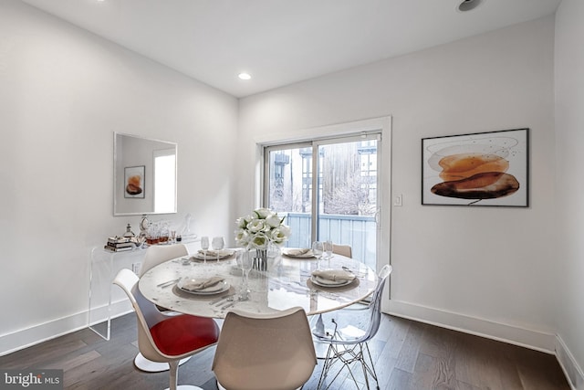 dining area with recessed lighting, dark wood-style flooring, and baseboards