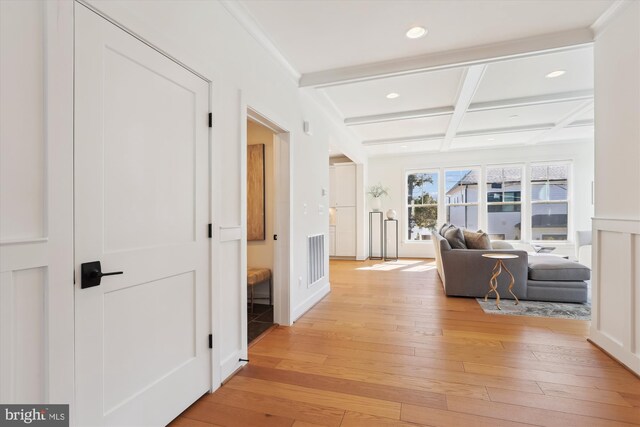 hall with visible vents, beamed ceiling, recessed lighting, light wood-style flooring, and coffered ceiling