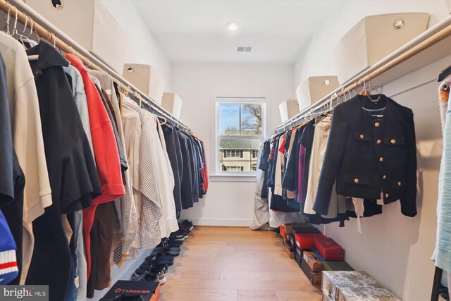 spacious closet with visible vents and wood finished floors