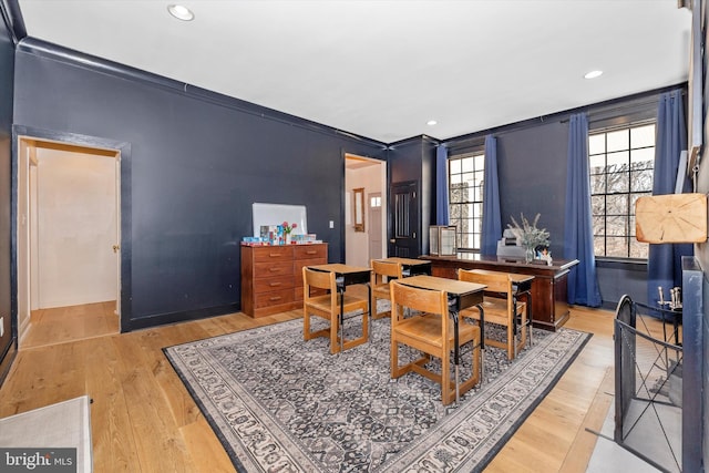 dining space featuring light wood-type flooring and recessed lighting