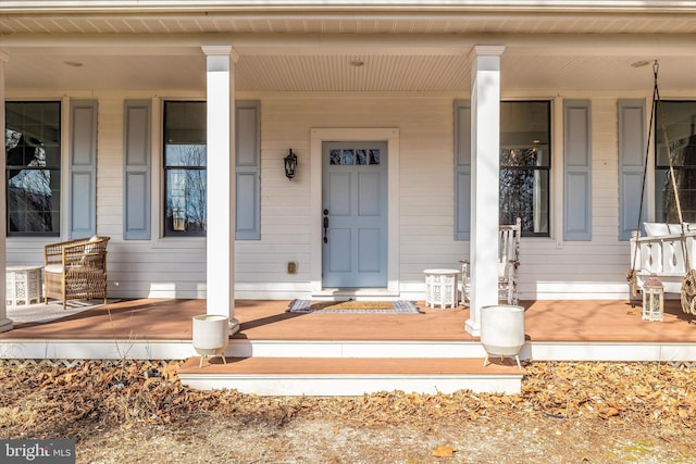 doorway to property with covered porch