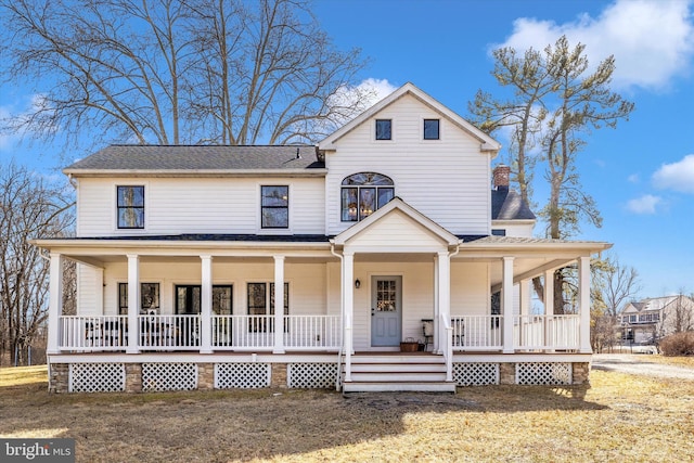 farmhouse featuring a porch and roof with shingles