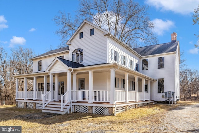 farmhouse with covered porch, a shingled roof, and a chimney