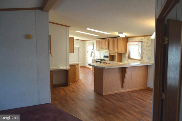 kitchen with a textured ceiling, white range with gas stovetop, wood finished floors, ornamental molding, and wallpapered walls