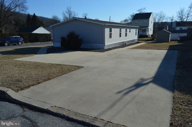 view of side of property with a yard