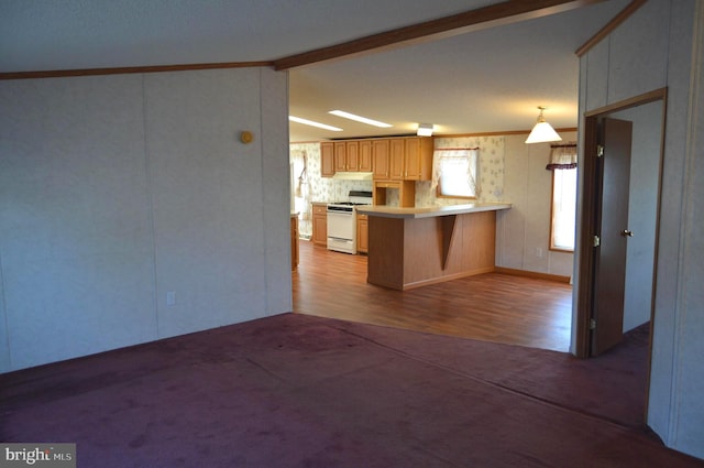 kitchen with crown molding, light countertops, lofted ceiling with beams, white range with gas cooktop, and a peninsula