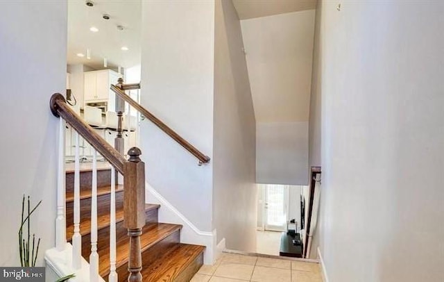 staircase featuring tile patterned floors