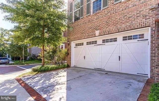 garage with concrete driveway