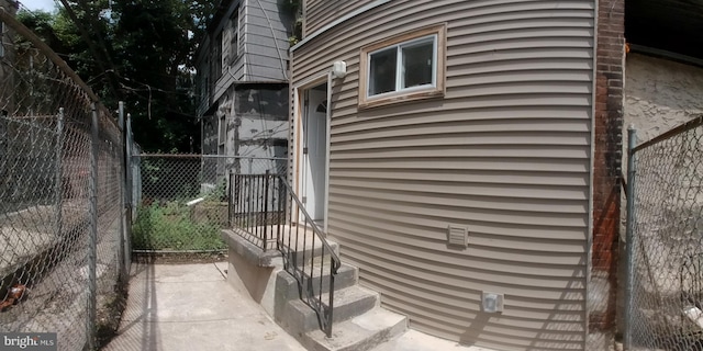 view of side of home with fence