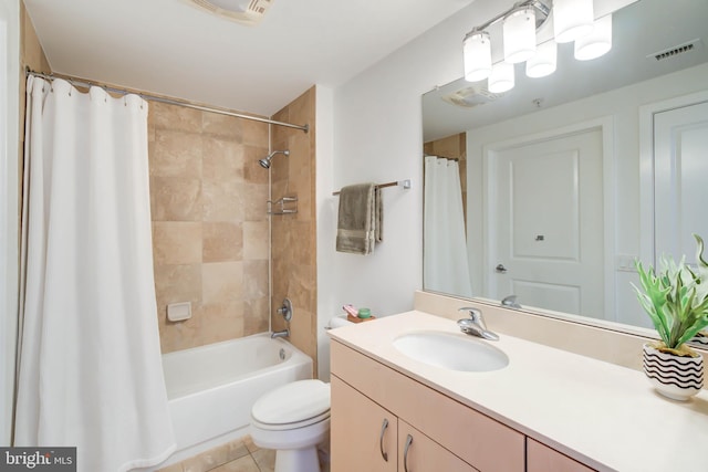 bathroom with visible vents, vanity, toilet, and tile patterned floors