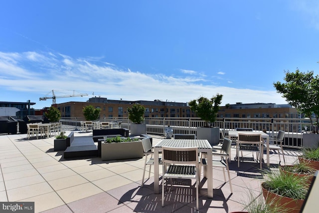 view of patio featuring outdoor dining area