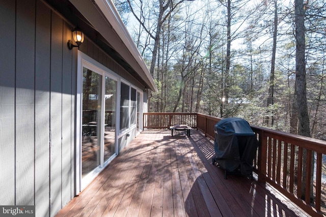 wooden terrace featuring grilling area