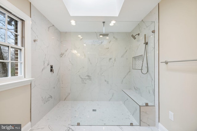 full bath featuring a marble finish shower, baseboards, and recessed lighting