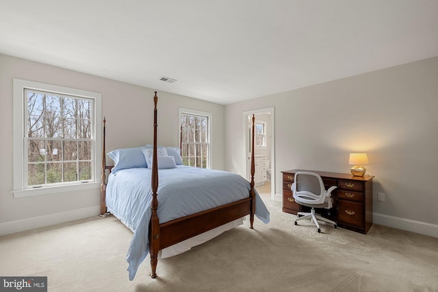 bedroom with baseboards, multiple windows, visible vents, and light colored carpet