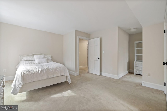 bedroom featuring carpet floors and baseboards