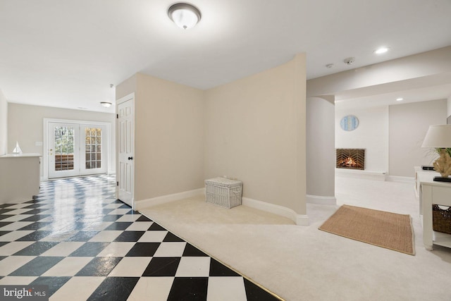 hallway with recessed lighting, baseboards, and tile patterned floors