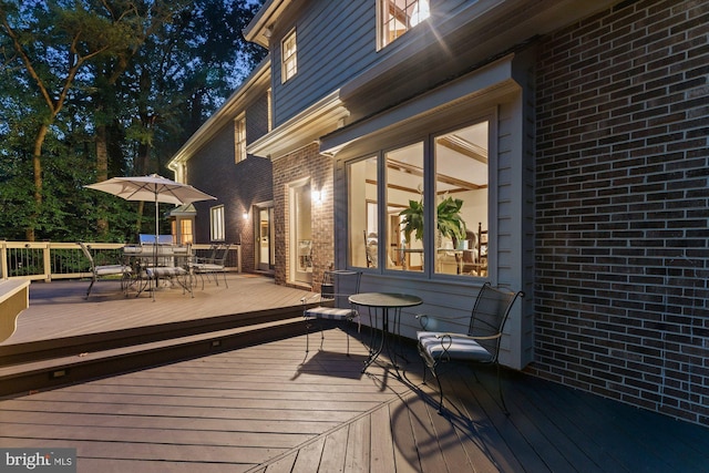 deck featuring outdoor dining area