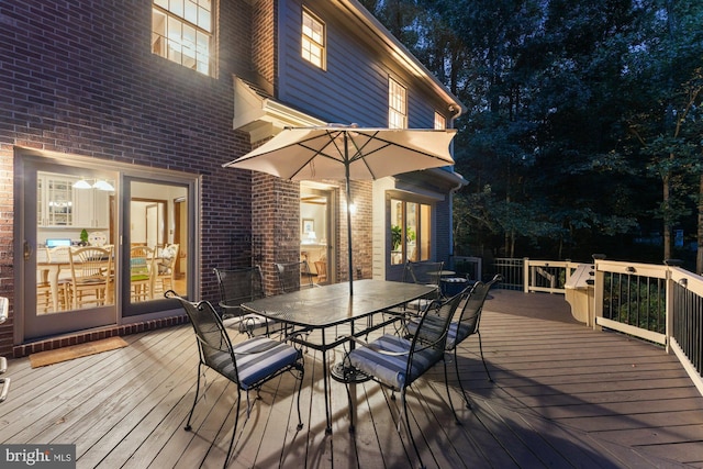 wooden deck featuring outdoor dining space