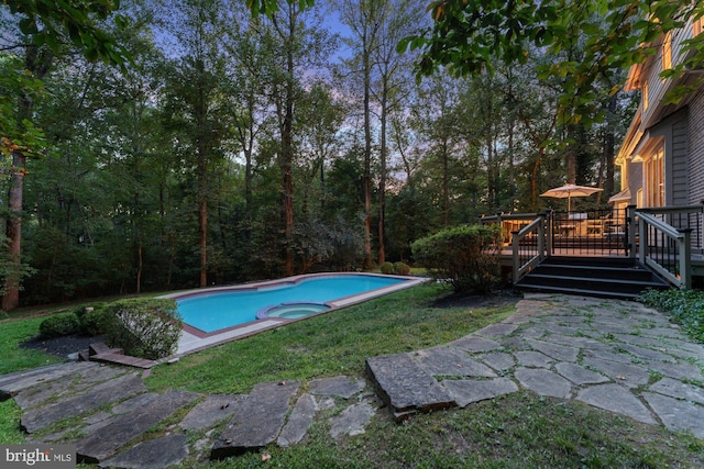 view of swimming pool with a deck, a patio, and a pool with connected hot tub