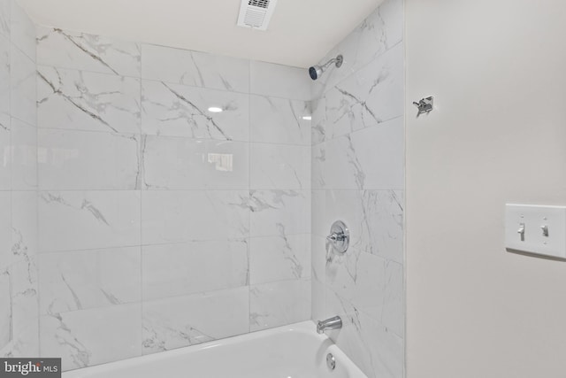 bathroom with tub / shower combination and visible vents