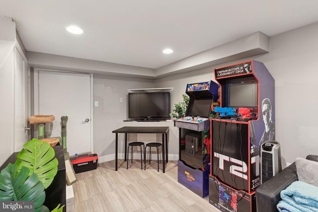 rec room with recessed lighting and baseboards