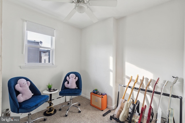 interior space featuring carpet, a ceiling fan, and baseboards