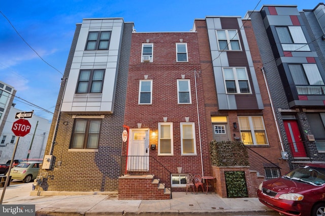 view of front of house with brick siding