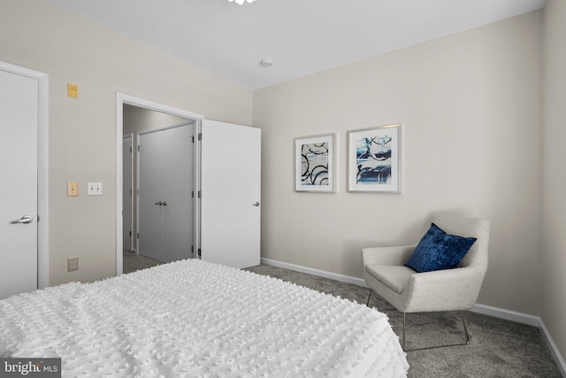 carpeted bedroom featuring baseboards