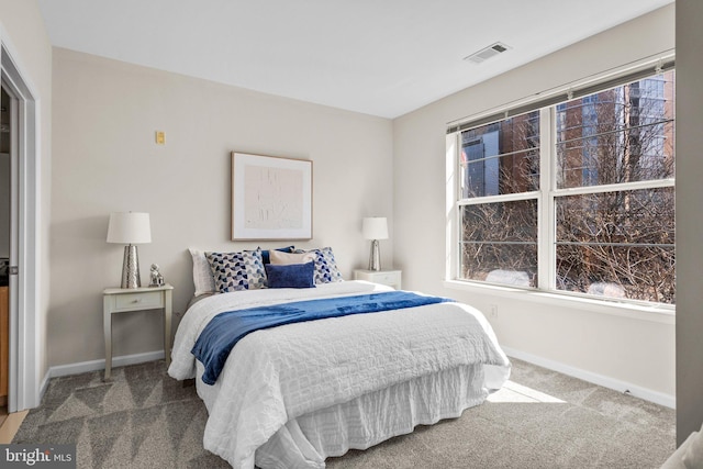 bedroom featuring carpet, visible vents, and baseboards