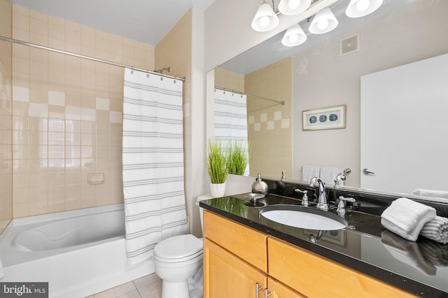 bathroom with vanity, shower / bathtub combination with curtain, visible vents, tile patterned flooring, and toilet