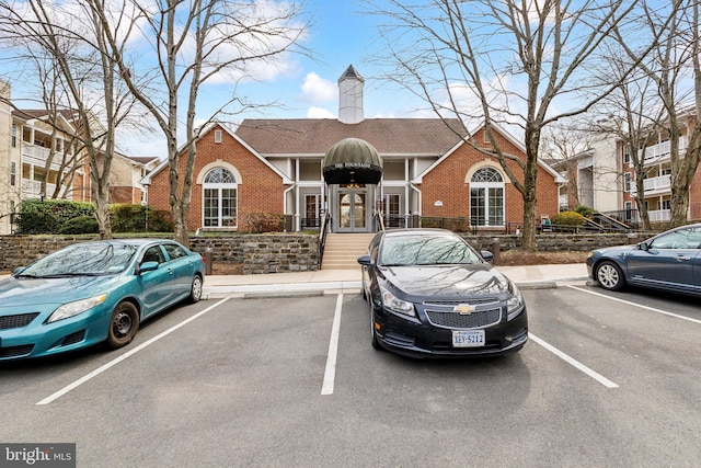 view of property featuring uncovered parking