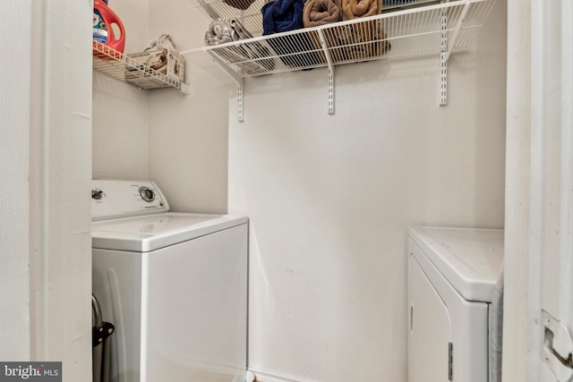 laundry area featuring laundry area and separate washer and dryer