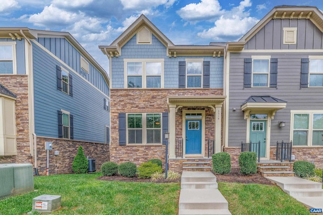 view of front of home featuring stone siding and central air condition unit