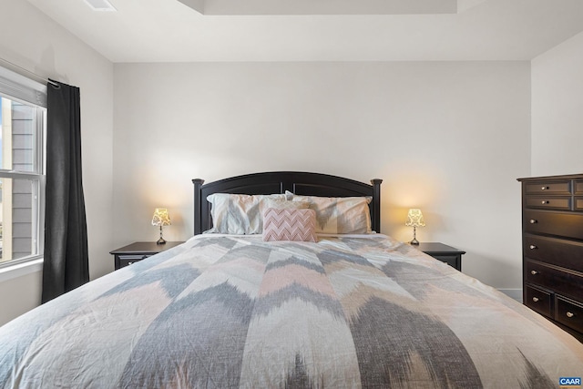 bedroom featuring multiple windows