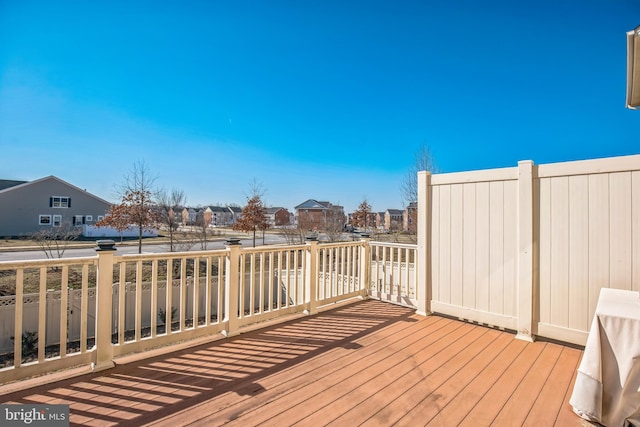 wooden deck with a residential view