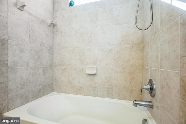 full bath featuring  shower combination