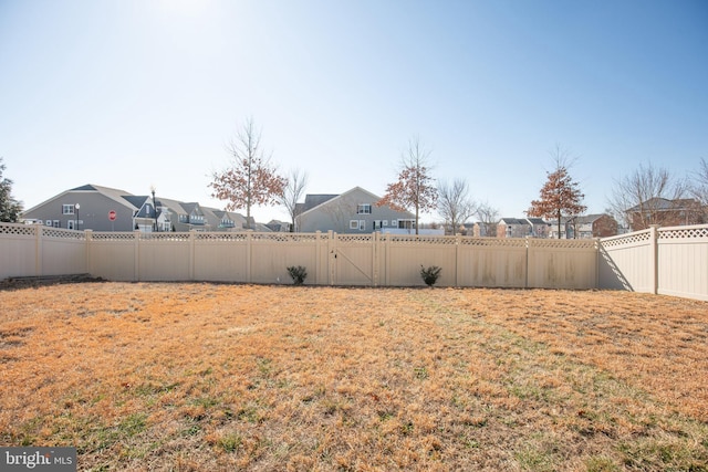 view of yard with a fenced backyard