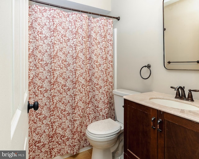 full bath featuring a shower with shower curtain, vanity, toilet, and tile patterned floors